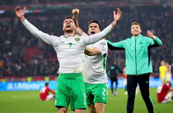 Ireland’s Troy Parrott and Séamus Coleman celebrate after the match against Hungary. Photos: INPHO