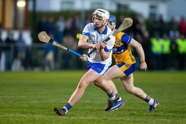 Waterford's Cathal O'Sullivan breaks away from the challenge of Clare's Sean Arthur. Waterford's Cathal O'Sullivan breaks away from the challenge of Clare's Sean Arthur.