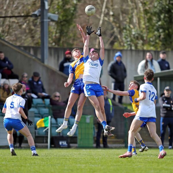 Waterford's Diarmuid Mackle in an air dual with Clare's Colm Breen.