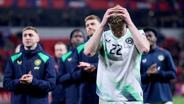 Ireland’s Nathan Collins dejected after the match as his side bow out of the World Cup qualifiers. Photo: INPHO/Ryan Byrne