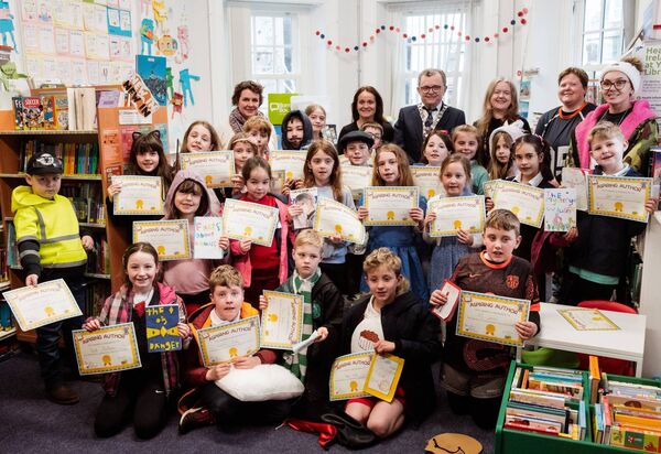 Mayor of Waterford City and County Cllr. Seamus Ryan with students from Réalt na Mara National School at the We are Writers book launch.