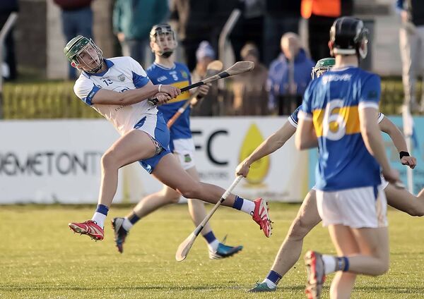 Waterford's Gearóid O'Shea fires over an early point for his side.
