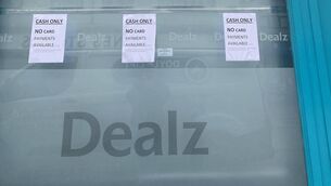 <p>There are more than ten signs on the shop front of Dealz, Michael Street, but staff say some people are still trying to pay by card. Photo: Libby Marchant</p>