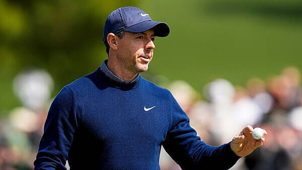 Rory McIlroy claims share of lead in hunt for back-to-back Masters victories