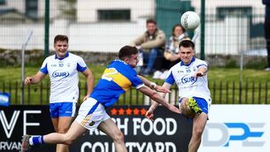 <p>Waterford's Alan Dunwoody gets his kick in under pressure from Tipperary's Jack O'Neill during their Munster Senior Football Championship quarter-final clash at Cappoquin Logistics Fraher Field. Photos: INPHO</p>