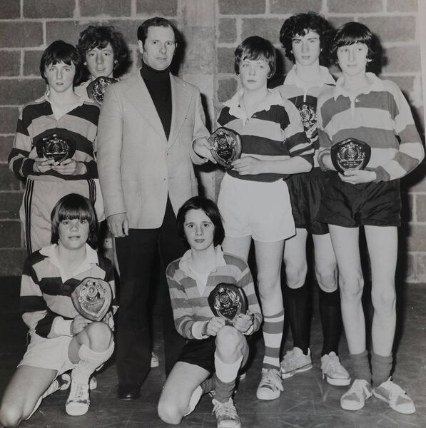 Mr. N. Knox on behalf of the PPU presents the winners with their trophies during the De La Salle 5-a-side 1977 competition
