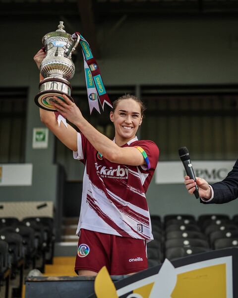 Carrie Dolan of Galway lifts the trophy after victory over Waterford. 