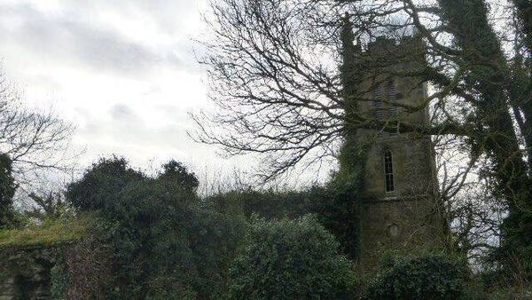 Graveyard in Waterford sinking into adjacent field