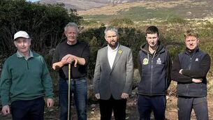 <p>Waterford Sinn Féin TD Conor McGuinness pictured with the affected farmers</p>