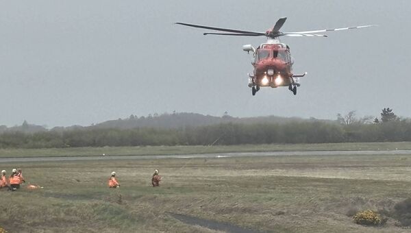 Coast Guard members perform a Search and Rescue drill at Waterford Airport