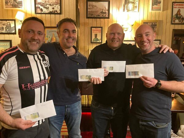 The winners of the Portlaw GAA quiz, Derek Delaney, Vic J Bowers, Freddy Kelly and David Walsh who donated their winnings back into the pot.