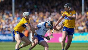 <p>Waterford's Austin Gleeson of Waterford in action against Clare's Ryan Taylor and Cathal Malone.</p>