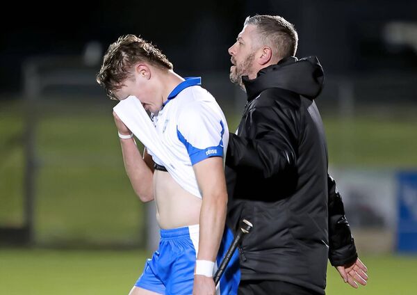 Waterford selector Nicholas Mackey commiserates with Waterford's Gearóid O'Shea at full time.