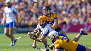 <p>Waterford's Sean Walsh in action against Clare's Tony Kelly and Conor Cleary at Cusack Park, Ennis. Photos: INPHO/Natasha Barton</p>