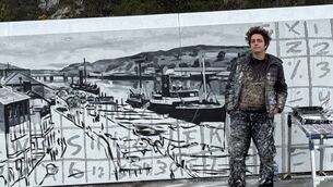 <p>Mariana Duarte Santos pictured alongside one of her new murals on Dock Road. Photo: Waterford City and County Council</p>