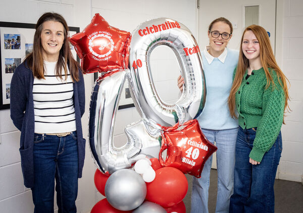 Teachers, Orla, Aileen and Saoirse, celebrating Gaelscoil Philib Barún's 40th anniversary.