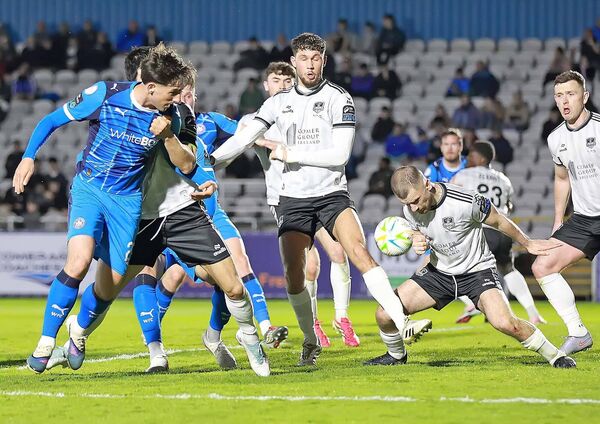 No penalty given for this handball after Dean McMenamy's header towards goal. 