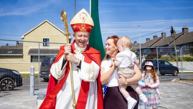 <p>Bishop Alphonsus Cullinan, along with Vicky and Paídí, admiring the new clock at St. Paul's Church. Photo: Joe Evans</p>