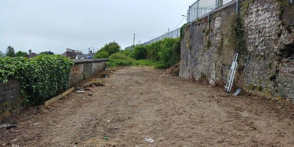 This was the space before a group of volunteers transformed it into a community garden.