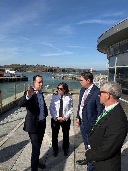Minister Cummins and Minister Heydon engaging with the Harbour Master and Department officials in Dunmore East.