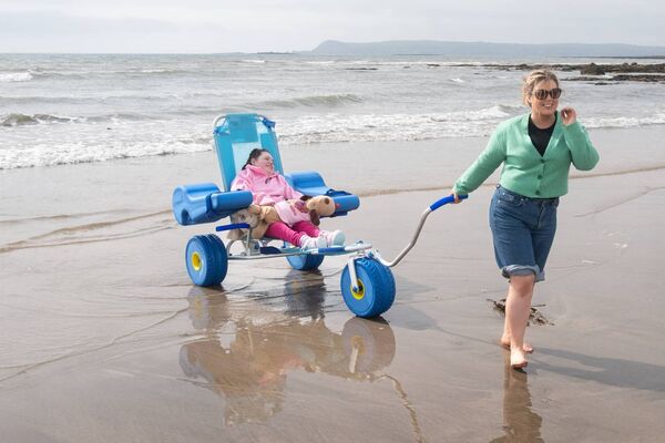 Emily Ahearne with her mum Ann at the launch of the Clonea Beach Wheelchair Pilot Scheme. Photo: David Clynch