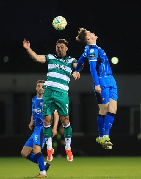 Shamrock Rovers defender Enda Stevens in an aerial duel with Waterford FC's Evan McLaughlin.