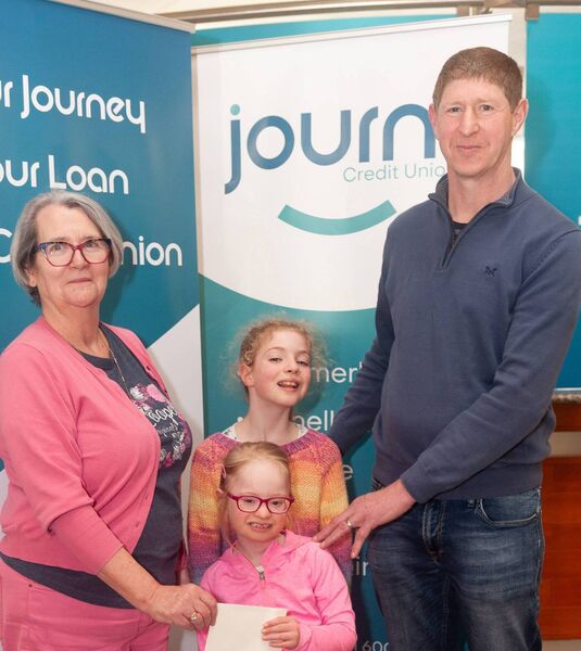 Linda O’Kane of Journi Credit Union is pictured presenting a donation to the Sunny South East Cycle, accepted by John Byrne, who is pictured with his daughters, Aoibhe and Jamie. 
