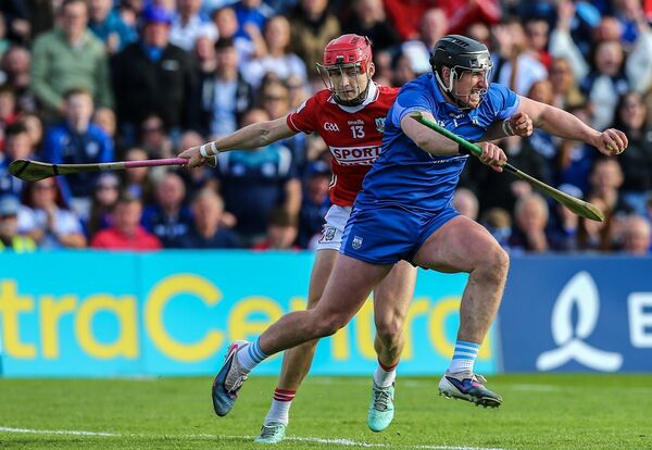 Waterford's Billy Nolan comes out with the sliothar under pressure from Cork's Alan Connolly.