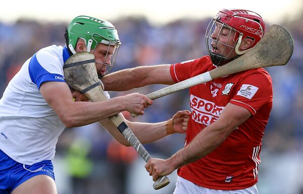 Cork's William Buckley in a tussle for possession with Waterford's Conor Keane.