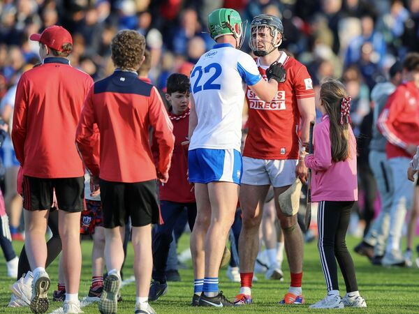 Cork's Darragh Fitzgibbon and Waterford's Michael Kiely shake hands at the end of the game.