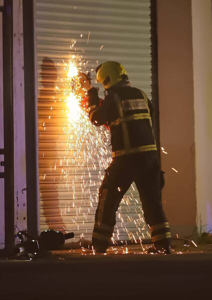 A member of the fire services tries to gain access to a section of the Tycor Business Centre.