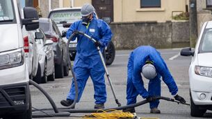 <p>Members of Gravity Asbestos Removal at the scene of the fire at the Tycor Business Centre. 	Photo: Joe Evans</p>