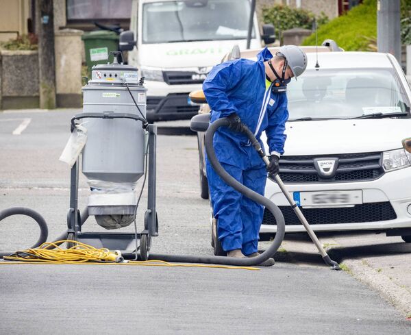 The clean up begins on streets surrounding the former Jute Factory premises.	Photo: Joe Evans