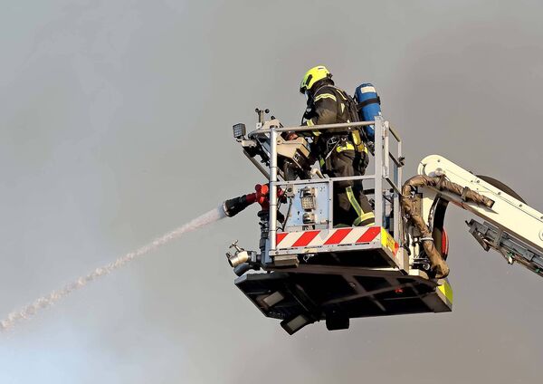 Firefighter tackling the blaze on Saturday last. Photo: Noel Browne