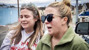 <p>Sisters Ellenor and Jean Upton, Waterford Centre of Music, speaking at the former Jute Factory after their premises was destroyed in the blaze. 	Photo: Joe Evans</p>