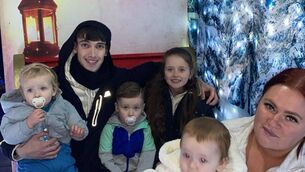 <p>Jayden and Nevaeh O'Neill (centre), who fell from a second-storey balcony, with their father Ryan O'Neill, mother Regina Smith, and siblings Jaxson (far left) and Alliyah (far right). Photo courtesy of Regina Smith</p>