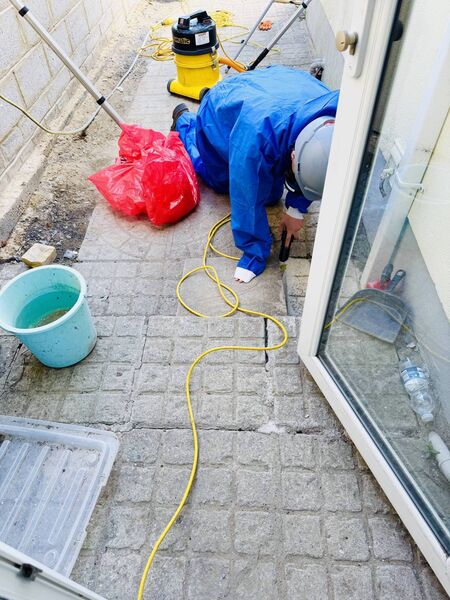 Gravity Construction working on cleaning rear garden patios close to the former Jute Factory fire location.