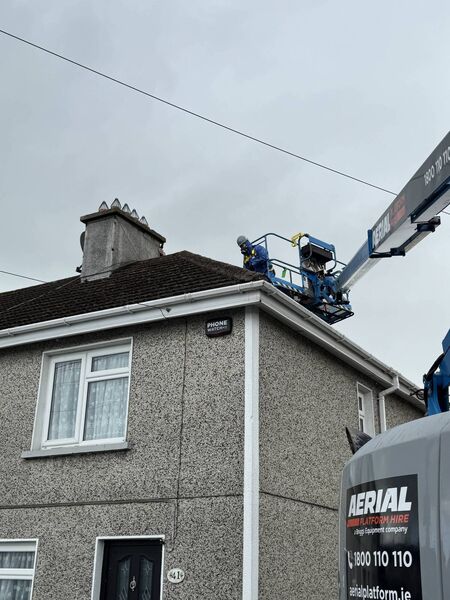Workers navigate high level cables close to the scene as part of the clean-up operation. 