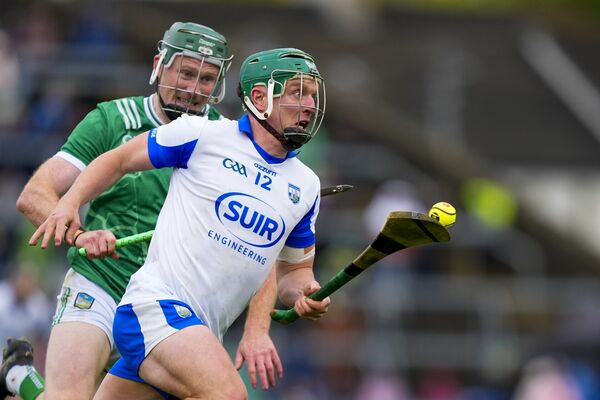 Waterford's Jack Prendergast in possession ahead of Limerick's Will O'Donoghue