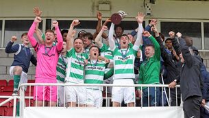 <p>Villa captain Luke Walsh lifts the McCarthy Insurance Group Munster Junior Cup in the air after their final success over Aisling Annacotty played at Munster FA Turner's Cross Stadium on Sunday last. Photos: Eddie Dee</p>
