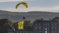 Greenpeace fly over Waterford Airport investor Kelcy Warren’s estate with sign: 'Stop the Billionaire Takeoff' 