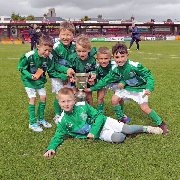 Young Villa fans celebrate with the Munster Junior Cup. Young Villa fans celebrate with the Munster Junior Cup.
