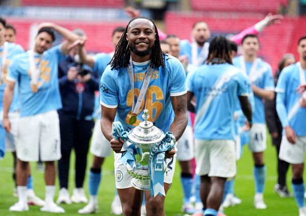 Manchester City's Antoine Semenyo celebrates with the FA Cup trophy following his sides victory over Chelsea at Wembley Stadium. Photo: Mike Egerton/PA Wire.