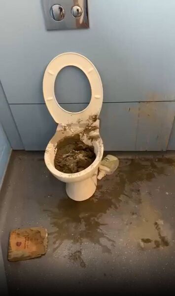 Screenshot of an Ardscoil na Mara toilet blocked with cement mix.