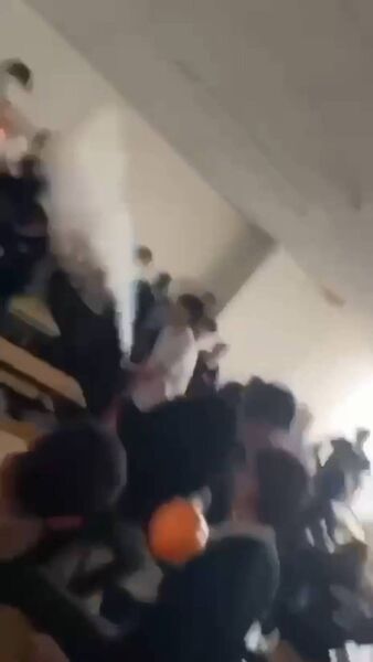 Videos show a student discharging a fire extinguisher in a classroom.