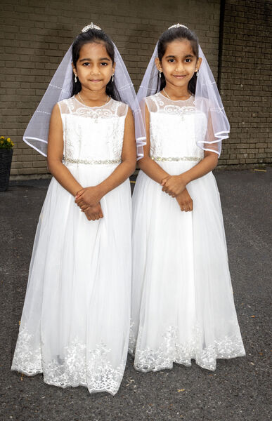 Twins, Caroline and Catherine Boban, St. John of God, who received their First Holy Communion at St. Joseph & St. Benildus Church. Twins, Caroline and Catherine Boban, St. John of God, who received their First Holy Communion at St. Joseph & St. Benildus Church.