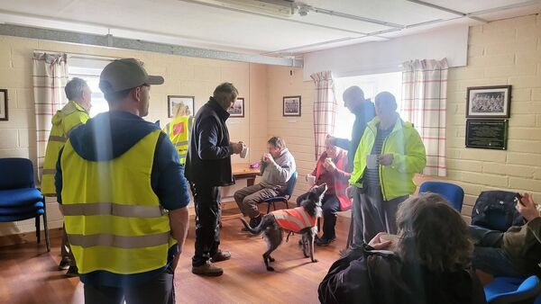 Some of those involved in the clean-up getting some well-earned treats over a cuppa