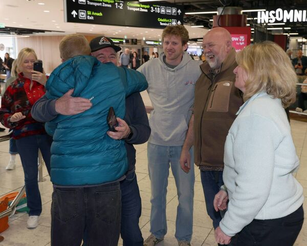 Family and friends welcome back Irish Everest expedition team member Adam Sweeney as he arrived home at Dublin Airport after successfully summiting Mount Everest. Picture: Brian McEvoy