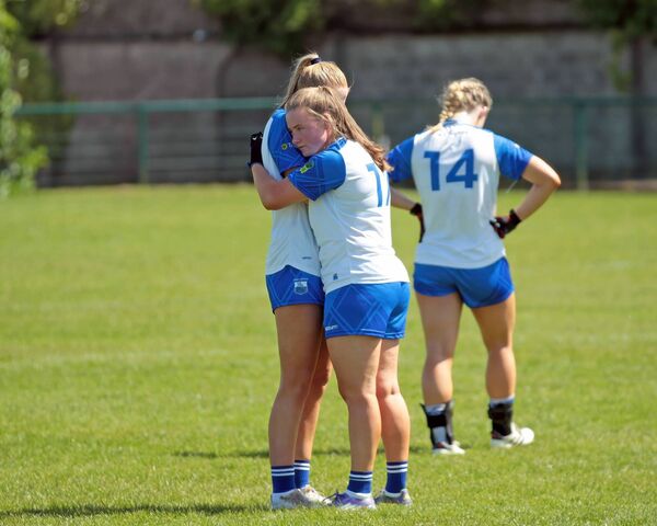 Waterford's Chloe Fennell consoles her teammate Claire Walsh.