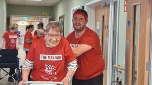 <p>Ann Van Hemelendonck with Chris Conroy, her physical activities coordinator.</p>
